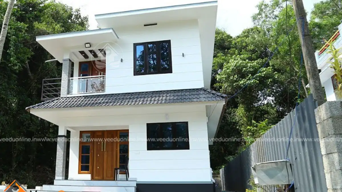 Small double floor house 1100 sq ft white contemporary Kerala home exterior