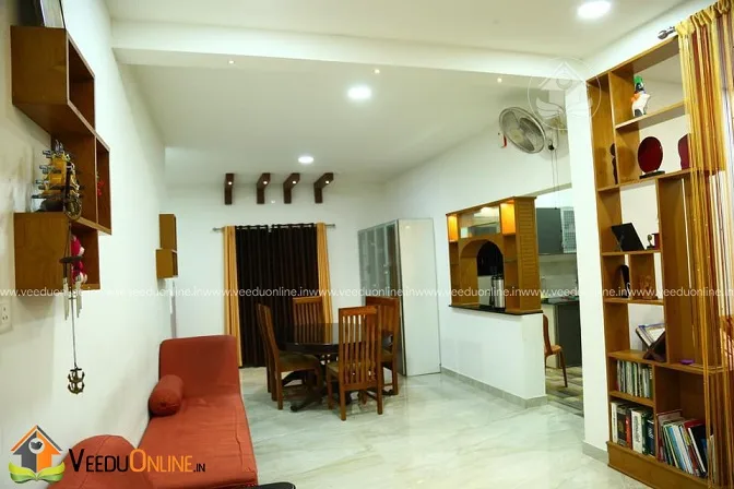 Living and dining area with wooden shelf partition