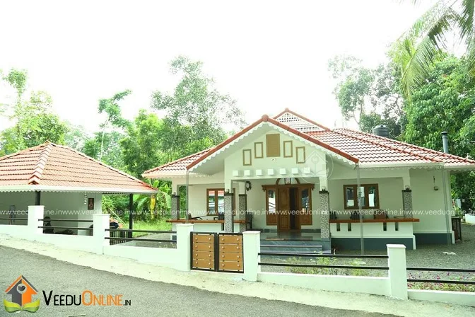 Front view of traditional Kerala house with compound wall in Kottayam