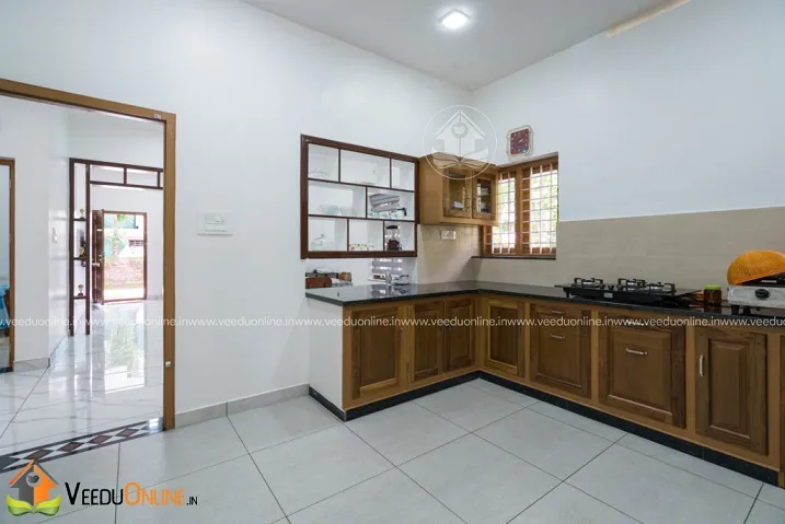 L-shaped kitchen with wooden cabinets