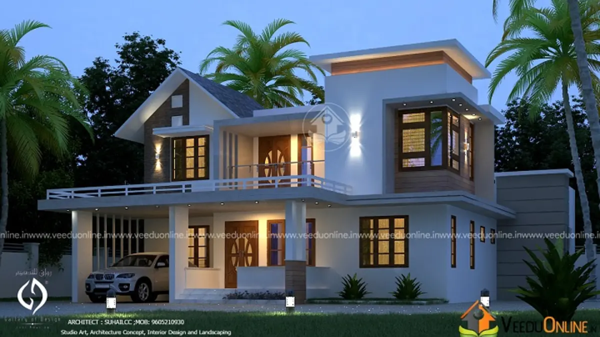 Classic Kerala house design 2100 sq ft double floor with sloping roof at dusk