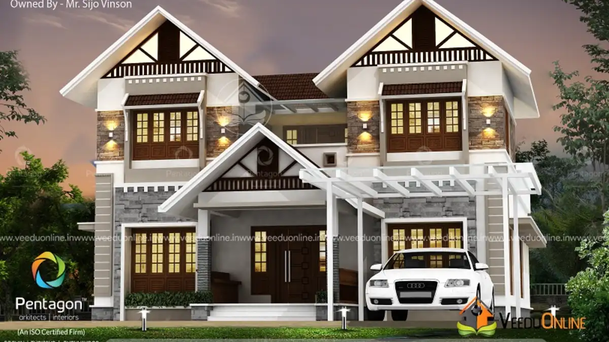Colonial style house Kerala 2436 sq ft with multiple gables at dusk