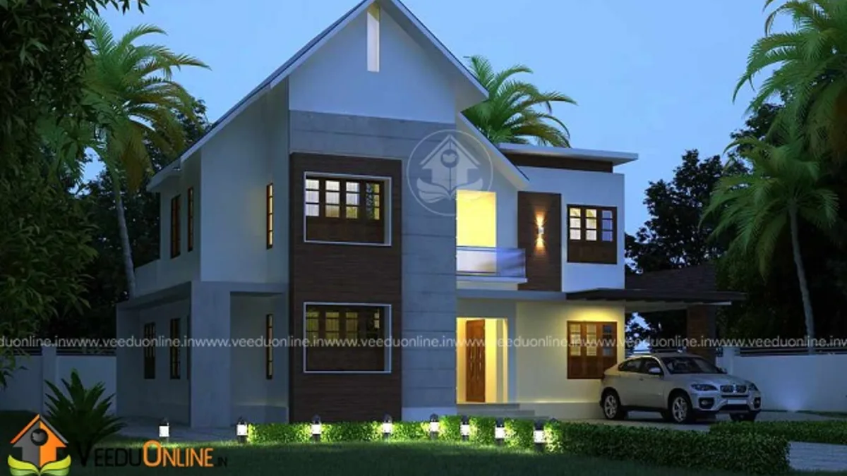Courtyard house plan 1650 sq ft Kerala home with sloping gable roof at night