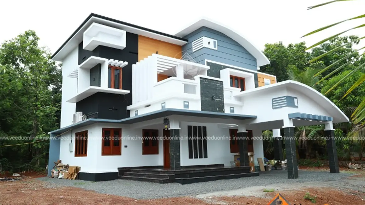 Curved roof house design 2278 sq ft modern double floor Kerala home