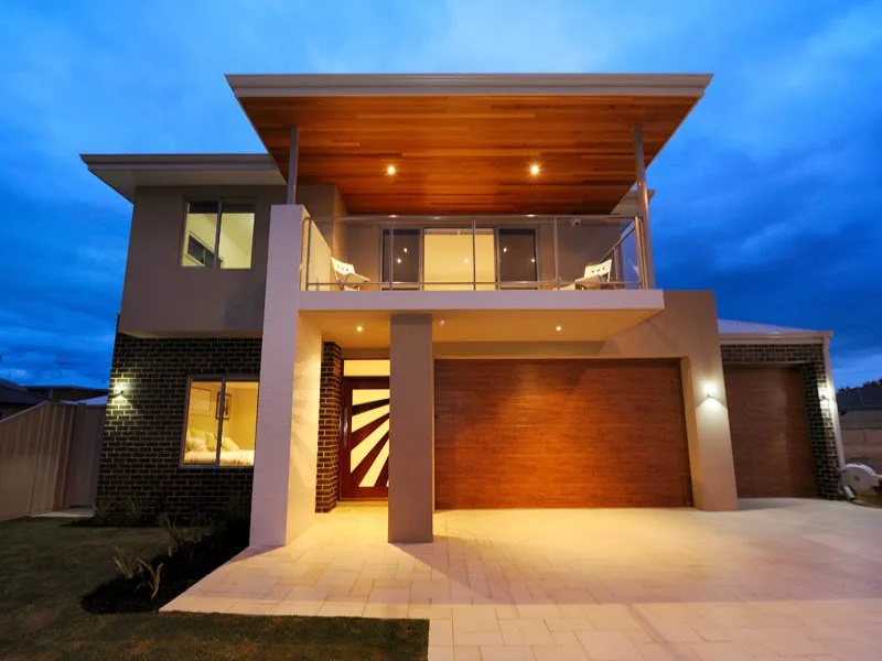 Modern two storey house with wooden cladding and garage