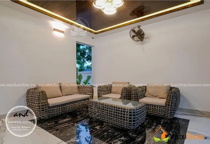 Lounge with wicker sofa set and glossy false ceiling
