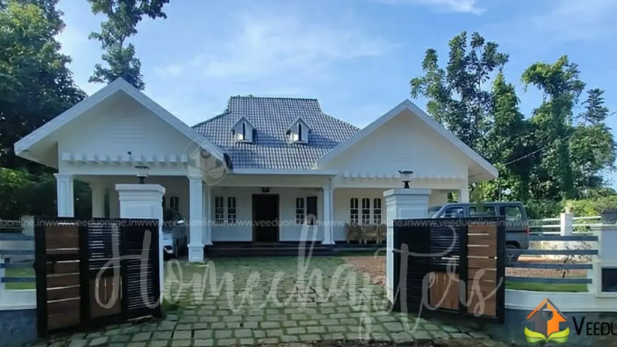 House with long sit out 2400 sq ft Kerala home with sloping roofs