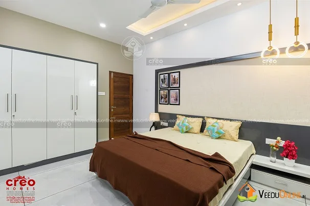 Bedroom with wooden headboard and false ceiling