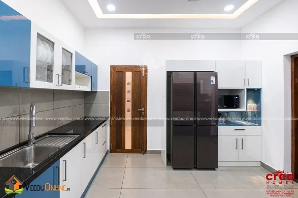 Kitchen with tall unit and refrigerator space