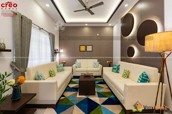Living room with grey sofas and circular wall decor