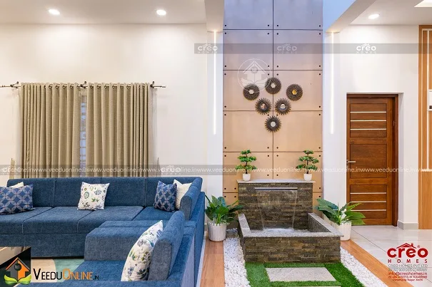 Family living with blue sofa and wall decor