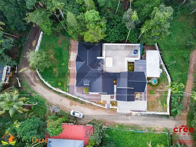 Aerial view of house among greenery