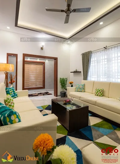Living area with patterned rug and accent lights