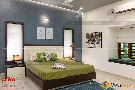 Bedroom with grey accent wall and window seat