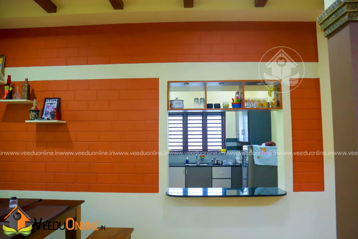 Kitchen opening with orange wall and serving counter
