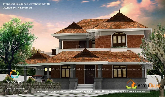 Side view of traditional Kerala house with red tiled roofs