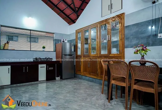 Dining area with wooden display cabinet and exposed tile ceiling