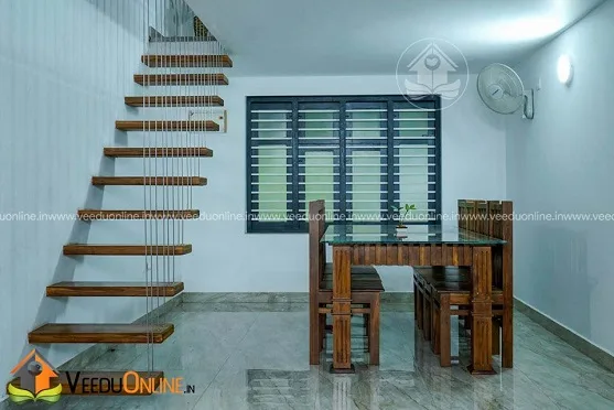 Floating wooden staircase leading to study loft