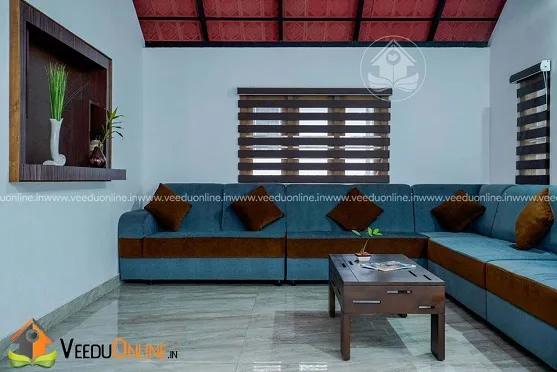 Living room with blue L-shaped sofa