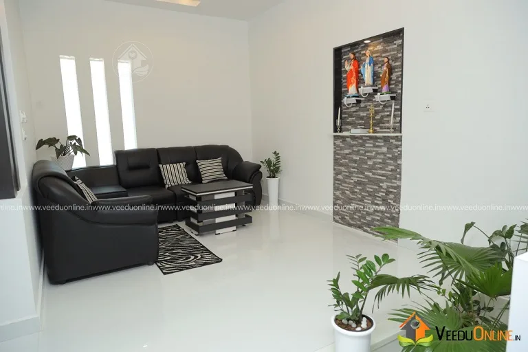 Living area with sofa and potted plants