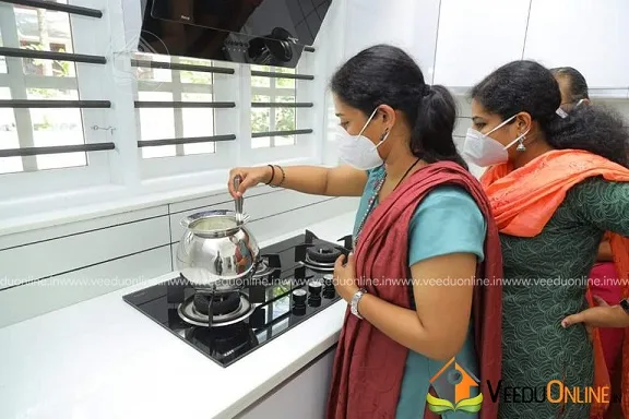 Family cooking in the new white kitchen