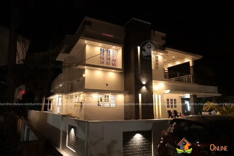 Night view of completed house with lights