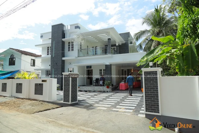 Daytime view of completed house exterior